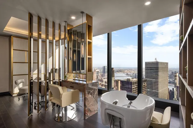 a bathroom with a glass shower door and a glass door
