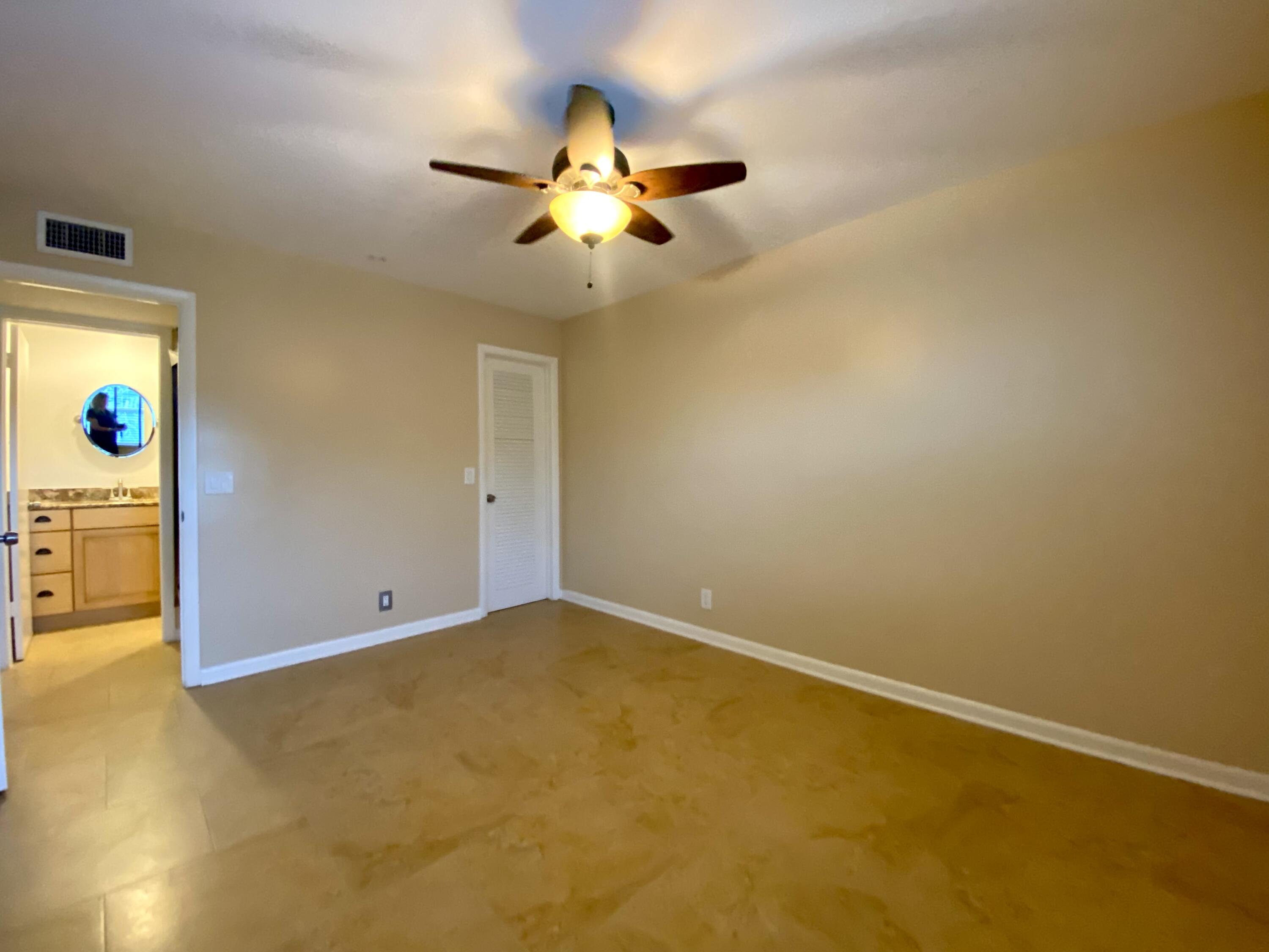 843 Flanders South Delray Beach, FL 33484 - Photo 15 of 29 an empty room with windows and ceiling fan
