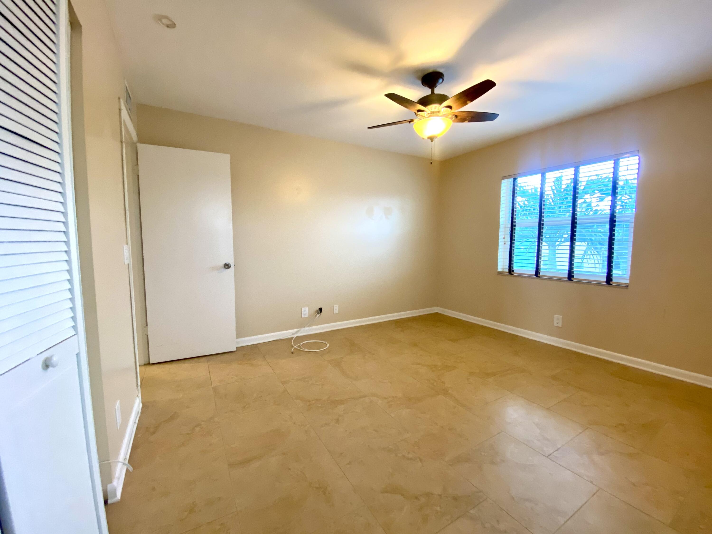 843 Flanders South Delray Beach, FL 33484 - Photo 20 of 29 a view of an empty room with a window