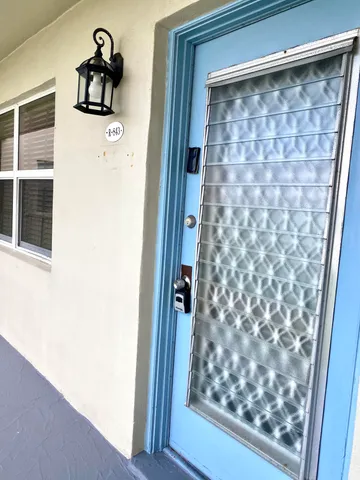 a bathroom with a shower and a sink