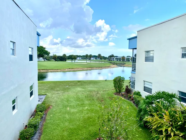 a view of a lake with a big yard