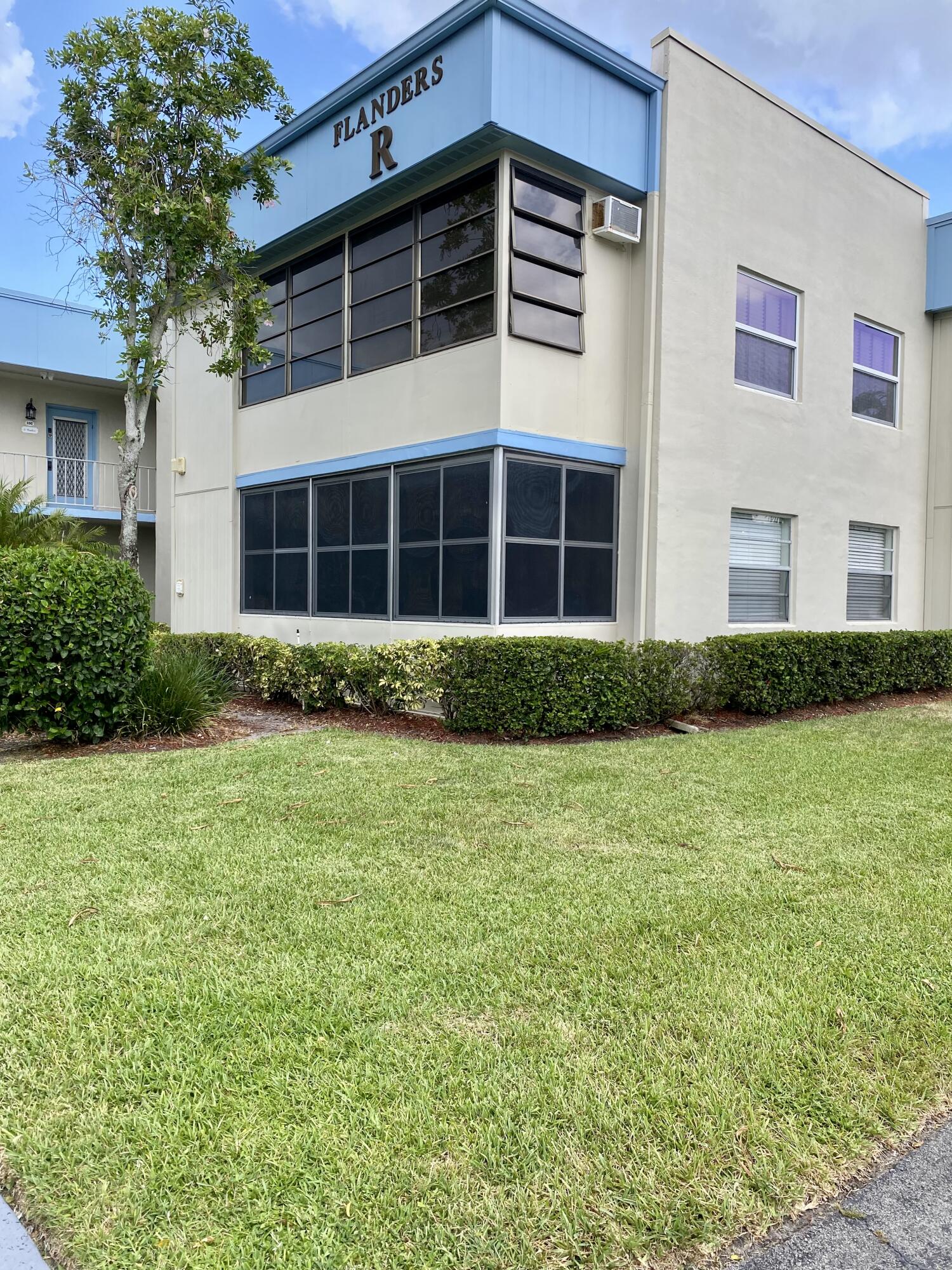 843 Flanders South Delray Beach, FL 33484 - Photo 28 of 29 a front view of a house with a yard