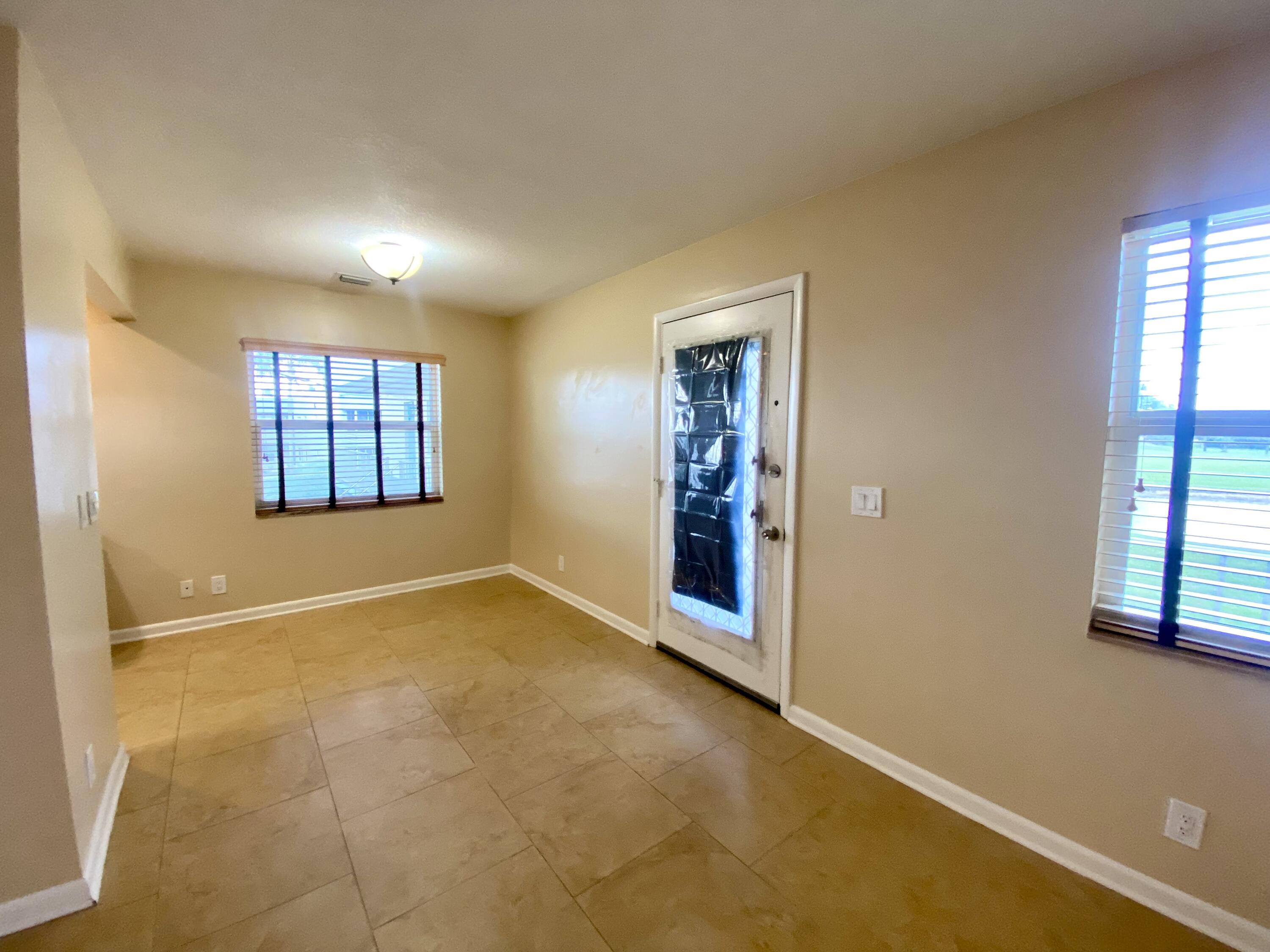 843 Flanders South Delray Beach, FL 33484 - Photo 8 of 29 an empty room with windows and closet