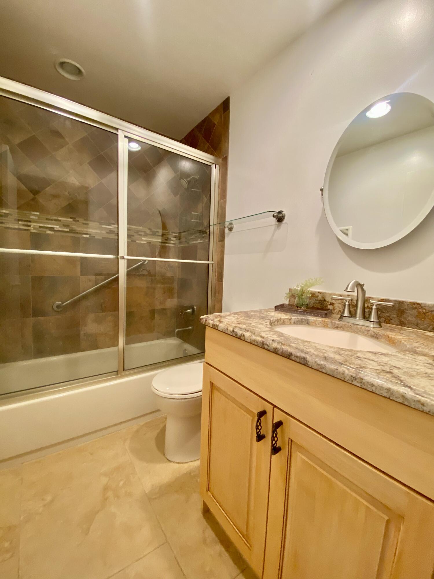 843 Flanders South Delray Beach, FL 33484 - Photo 10 of 29 a bathroom with a granite countertop sink toilet and shower