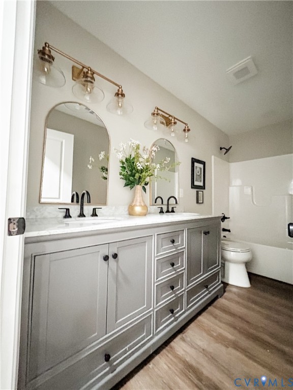 10295 Ashcake Road Ashland, VA 23005 - Photo 23 of 24 Double vanity with gray cabinetry, white counterto