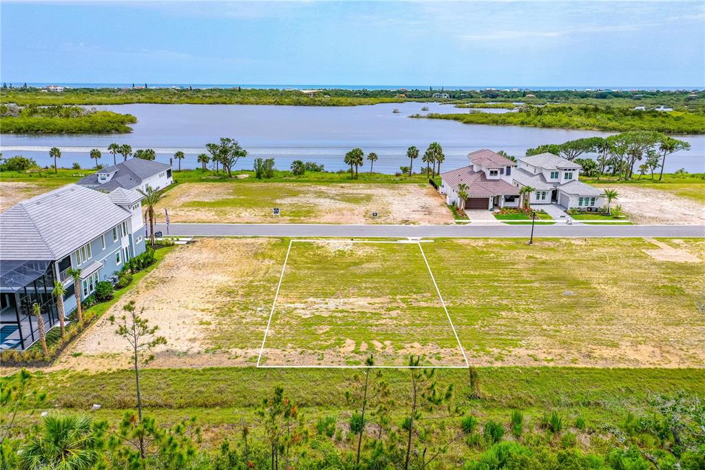 89 Coronado Road Flagler Beach, FL 32136 - Photo 11 of 19 a view of a swimming pool and lake view
