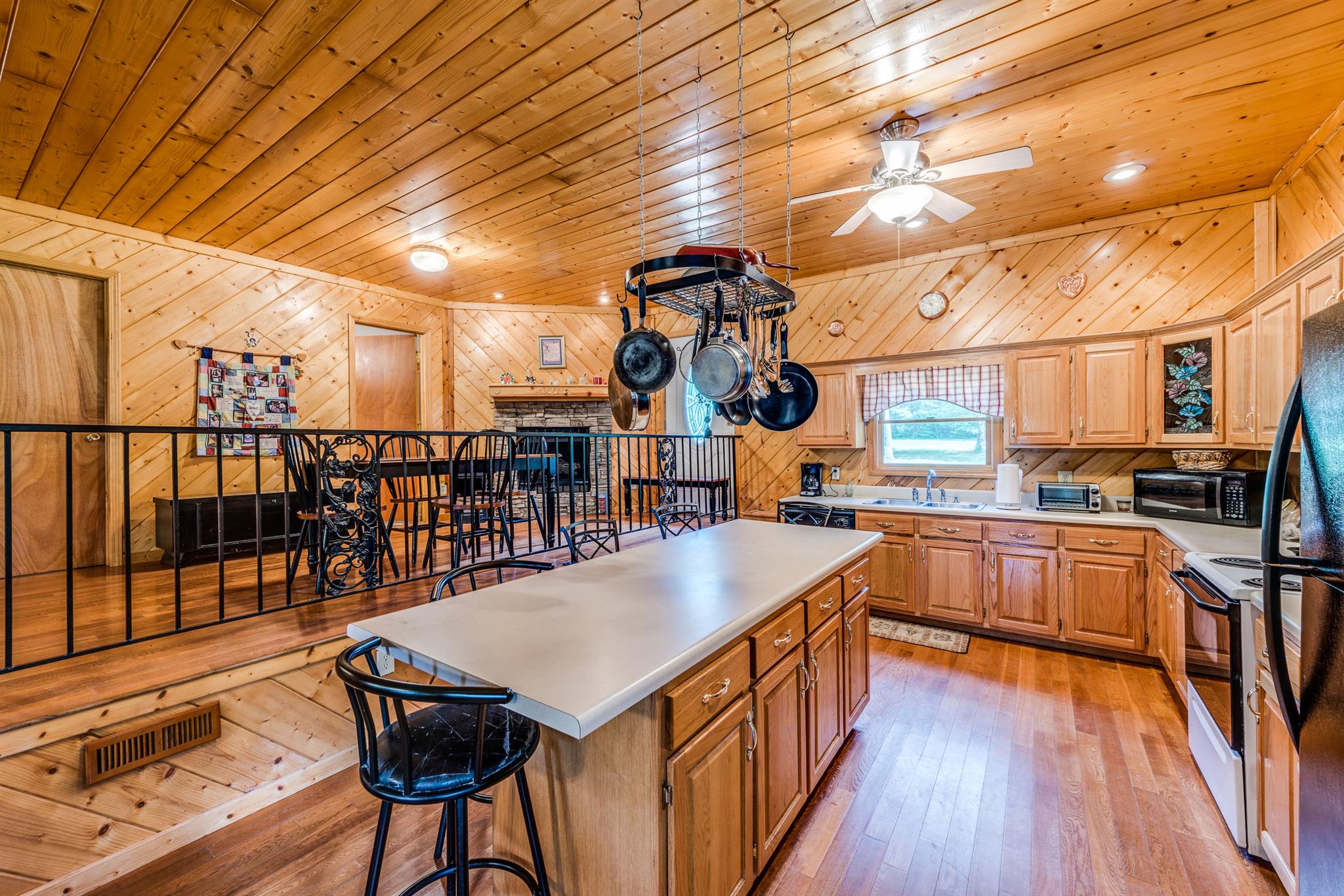 1774 York Road Crossville, TN 38555 - Photo 3 of 25 a view of a kitchen with wooden floor and iron stairs