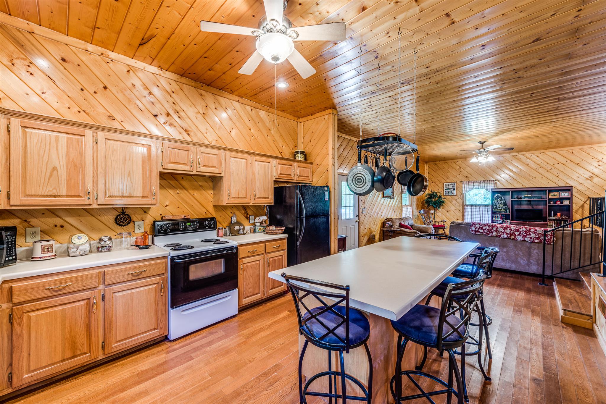 1774 York Road Crossville, TN 38555 - Photo 8 of 25 a kitchen with stainless steel appliances a stove a sink dishwasher and cabinets with wooden floor