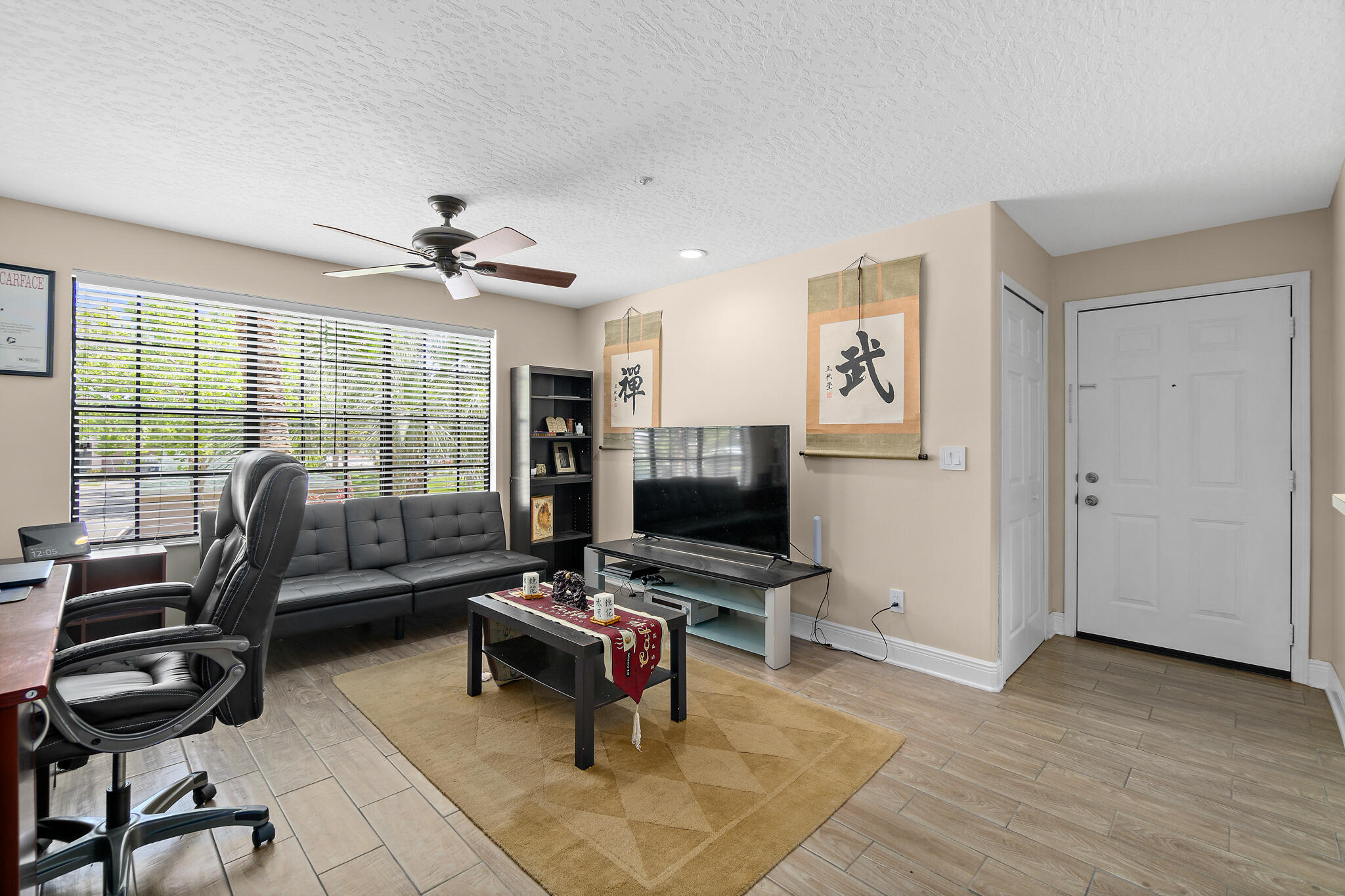 7667 North Wickham Road, Unit 511 Melbourne, FL 32940 - Photo 12 of 48 a view of a livingroom with workspace and a window