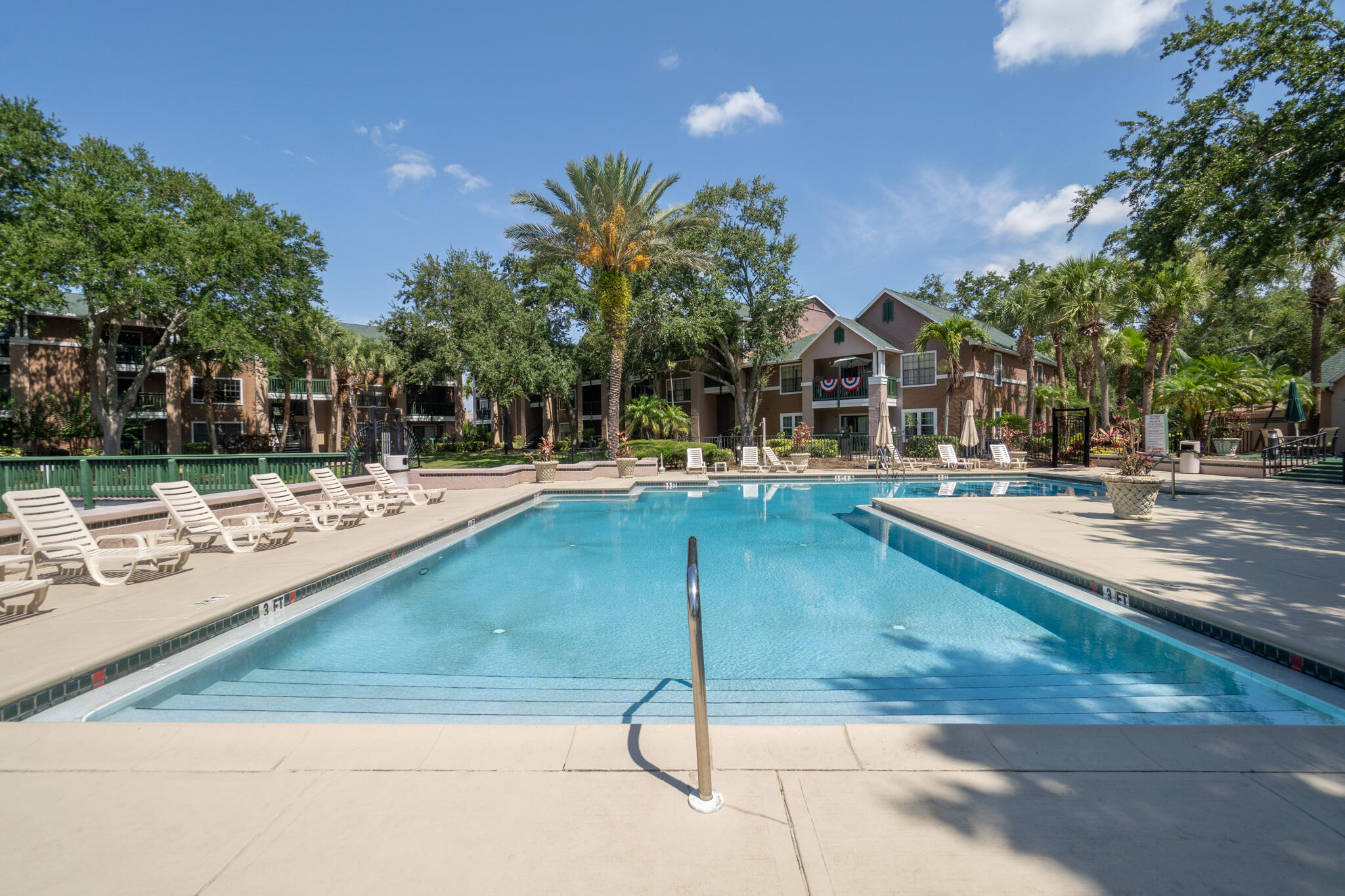 7667 North Wickham Road, Unit 511 Melbourne, FL 32940 - Photo 16 of 48 a view of a swimming pool with a patio