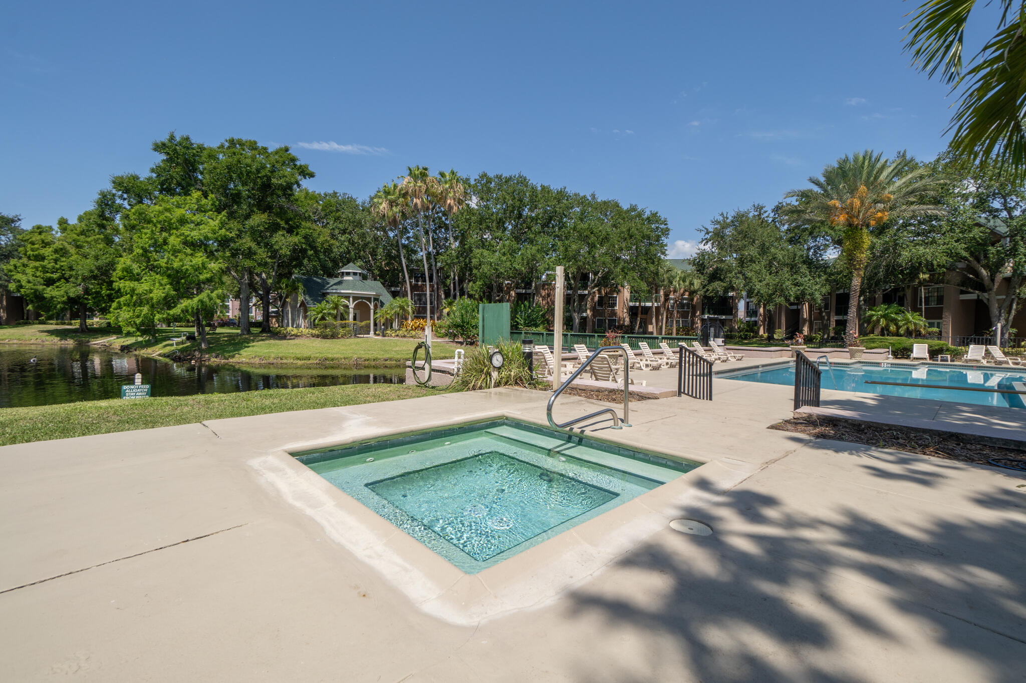 7667 North Wickham Road, Unit 511 Melbourne, FL 32940 - Photo 19 of 48 a view of a swimming pool with a patio