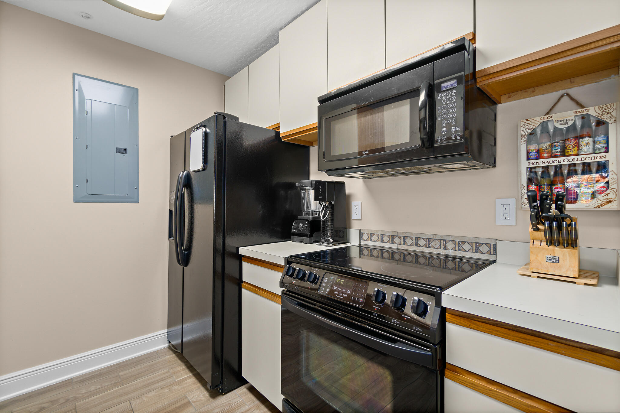 7667 North Wickham Road, Unit 511 Melbourne, FL 32940 - Photo 24 of 48 a kitchen with a stove and a microwave