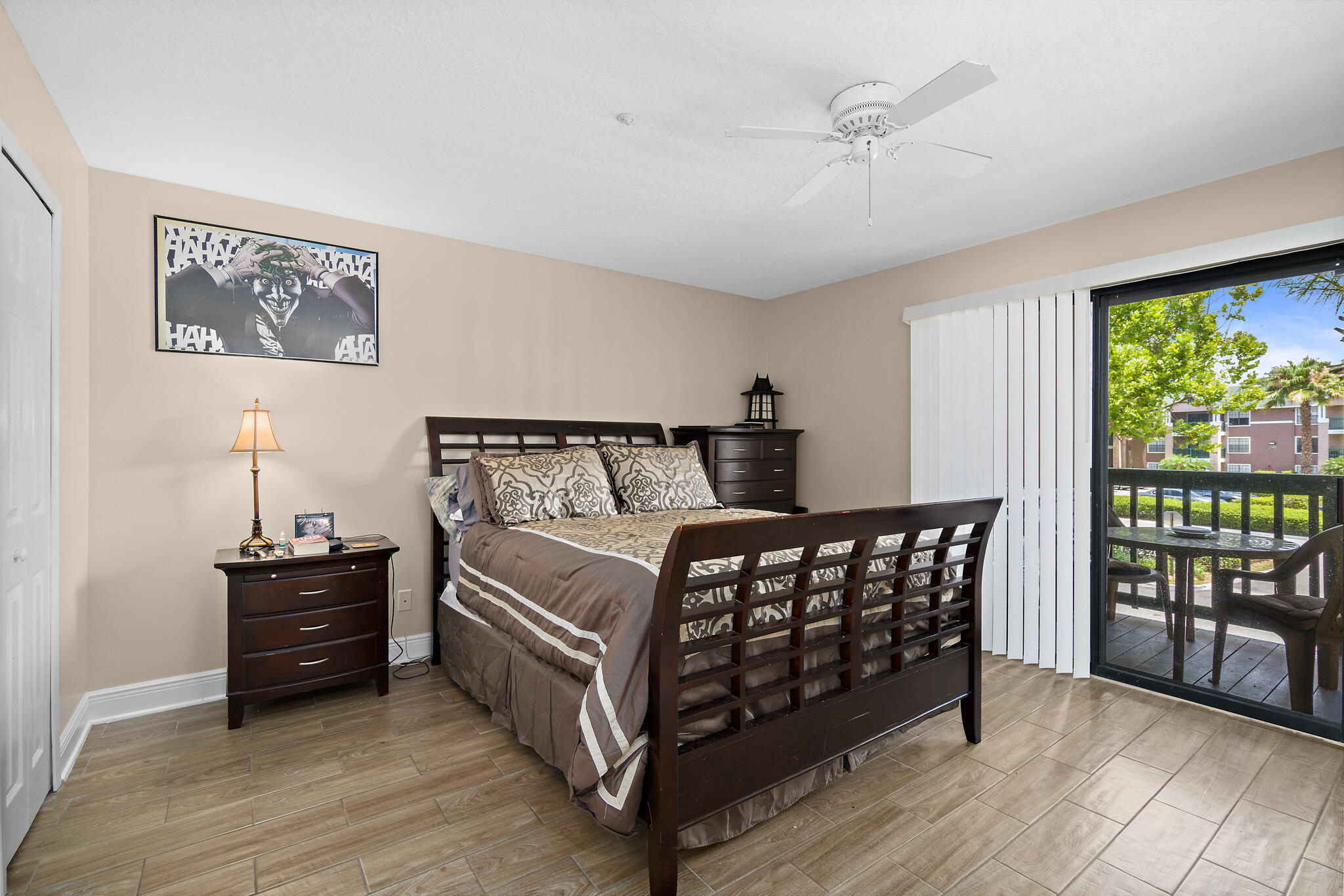 7667 North Wickham Road, Unit 511 Melbourne, FL 32940 - Photo 26 of 48 a bedroom with a bed window and a table