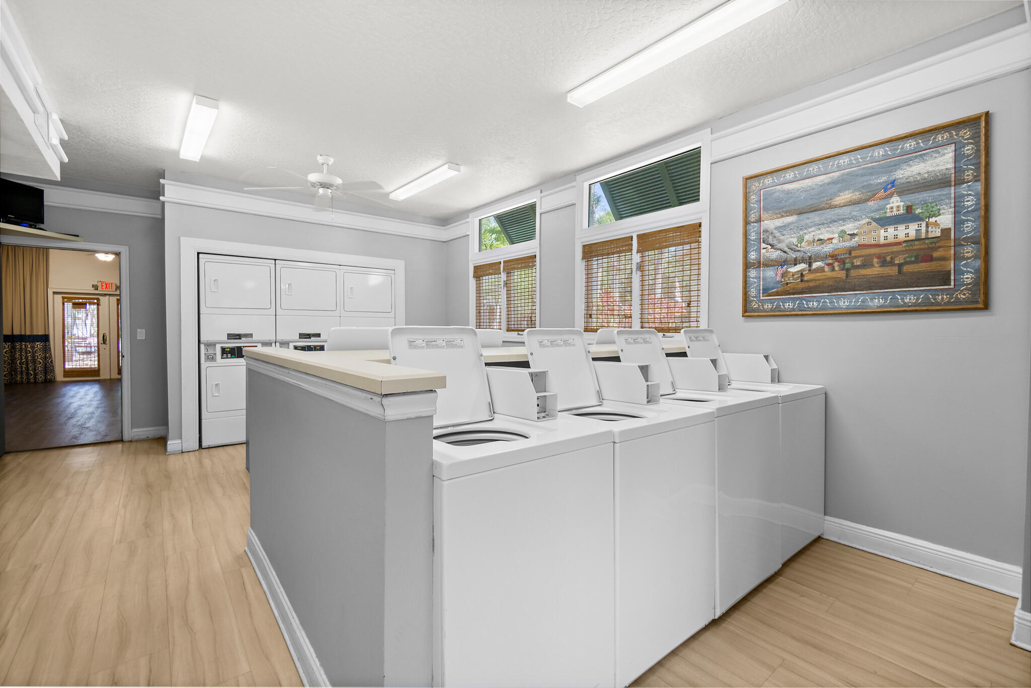 7667 North Wickham Road, Unit 511 Melbourne, FL 32940 - Photo 28 of 48 a view of kitchen with stainless steel appliances granite countertop a sink and dishwasher with wooden floor