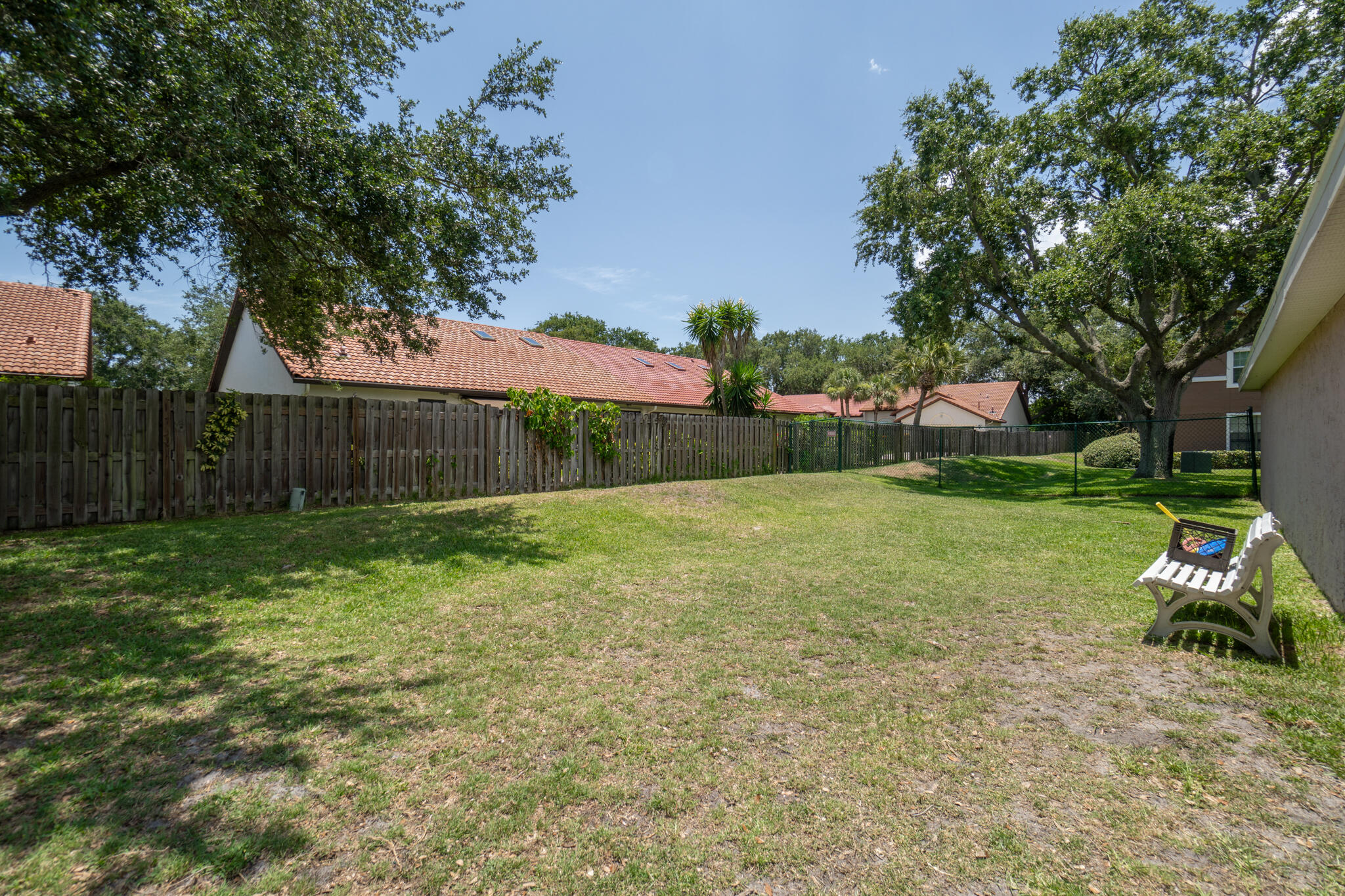 7667 North Wickham Road, Unit 511 Melbourne, FL 32940 - Photo 33 of 48 a view of a backyard with a garden and entertaining space