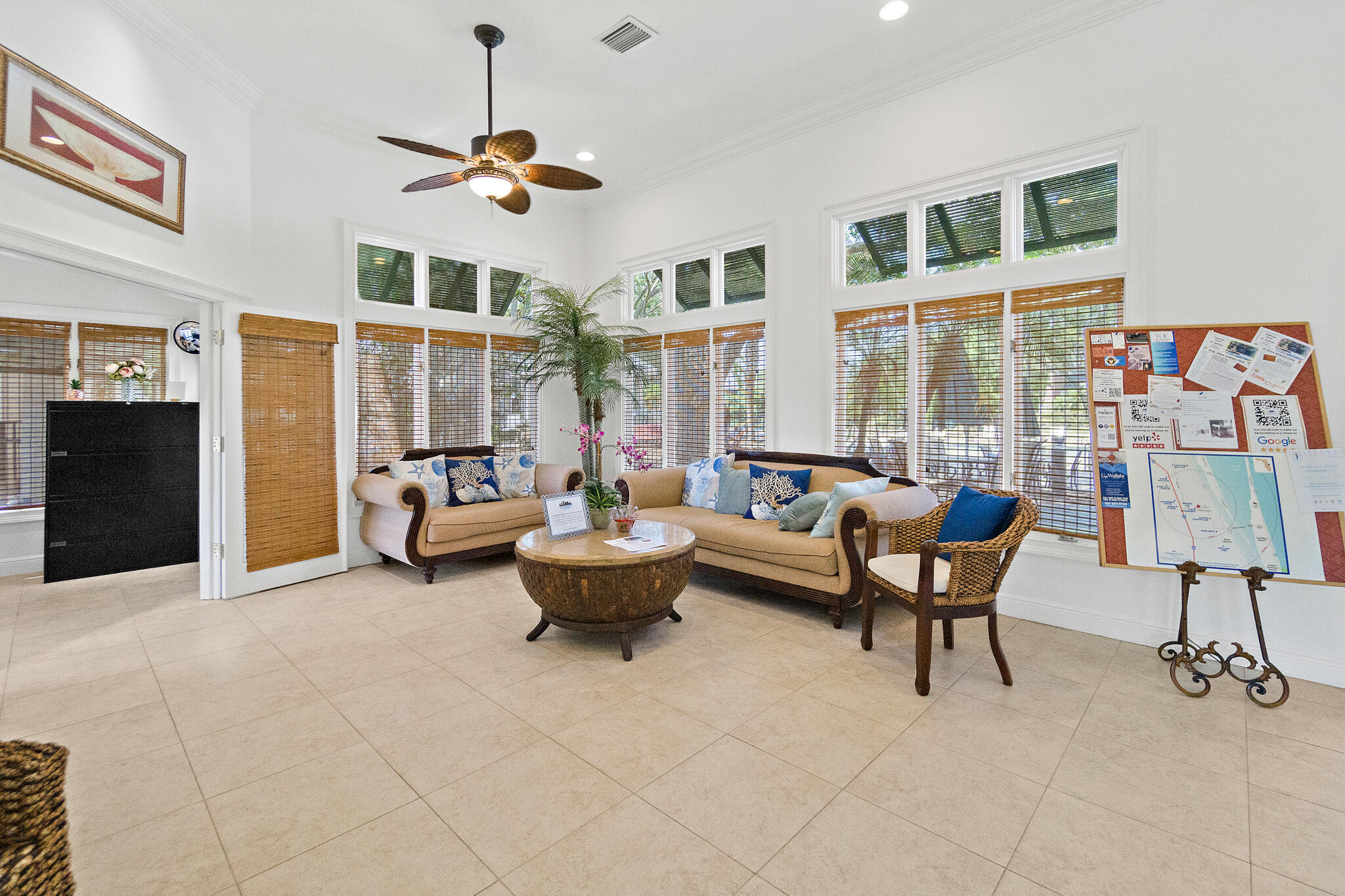 7667 North Wickham Road, Unit 511 Melbourne, FL 32940 - Photo 45 of 48 a living room with furniture and a floor to ceiling window