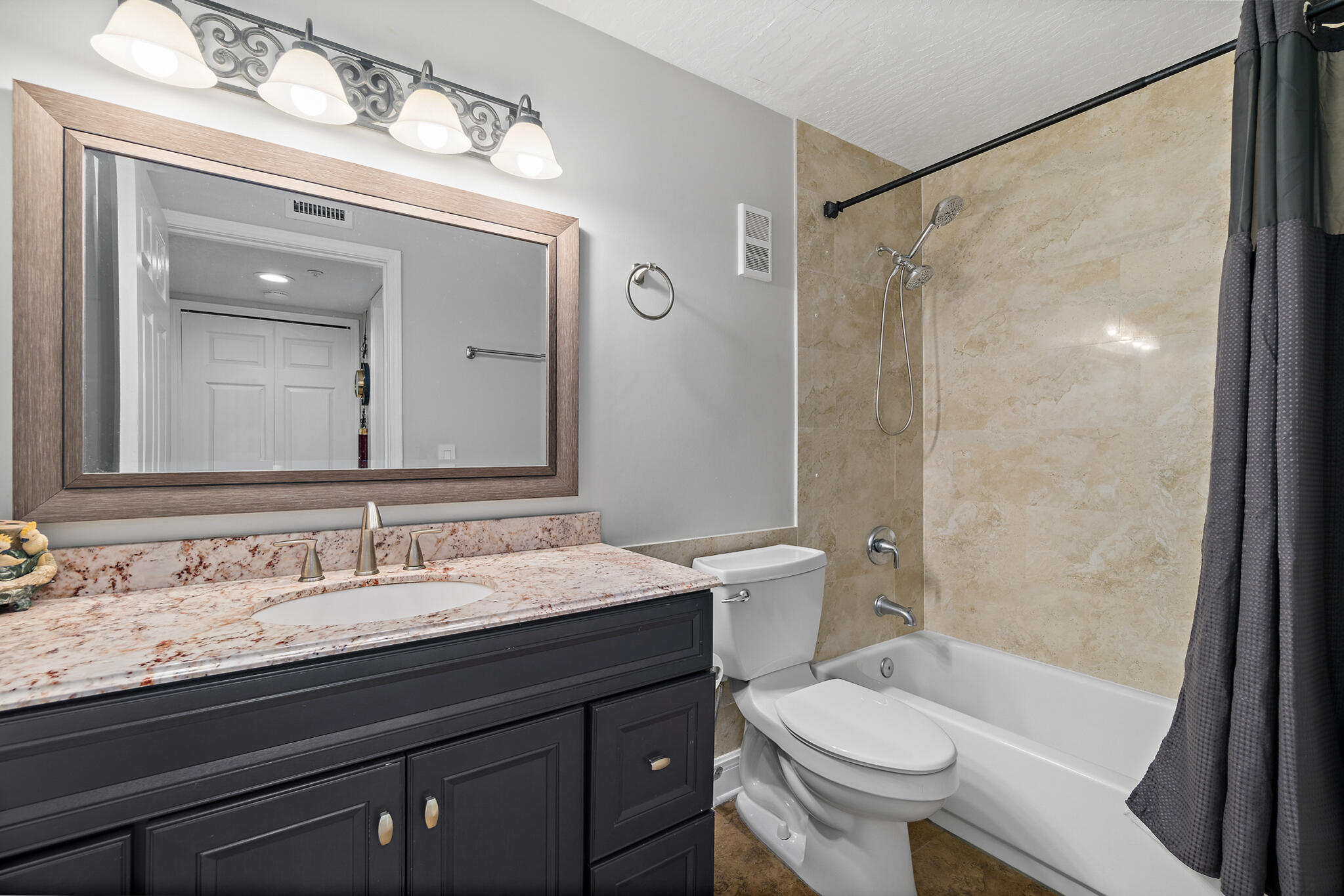 7667 North Wickham Road, Unit 511 Melbourne, FL 32940 - Photo 6 of 48 a bathroom with a sink and a mirror