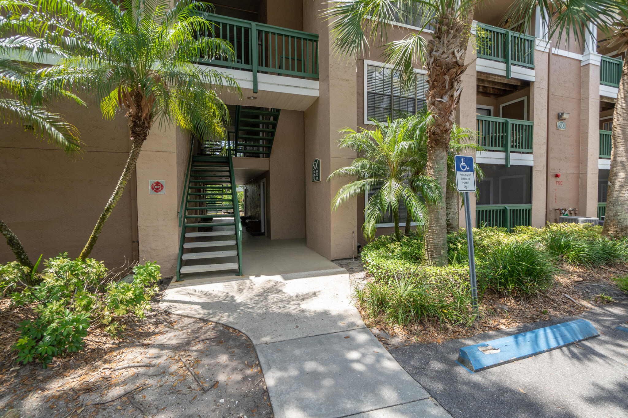 7667 North Wickham Road, Unit 511 Melbourne, FL 32940 - Photo 10 of 48 a front view of a house with garden