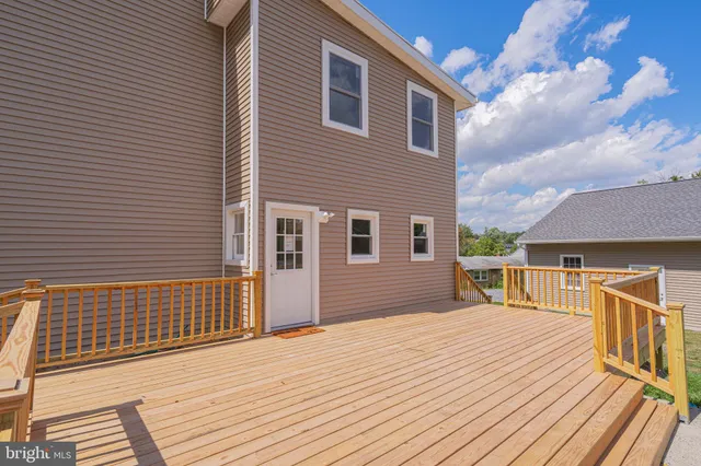 a view of a house with a barbeque