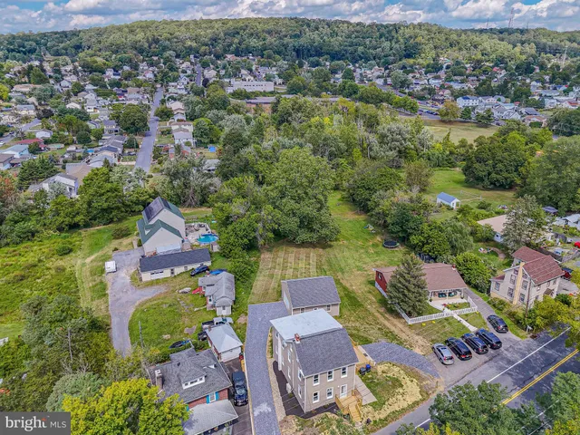 an aerial view of a house with a garden
