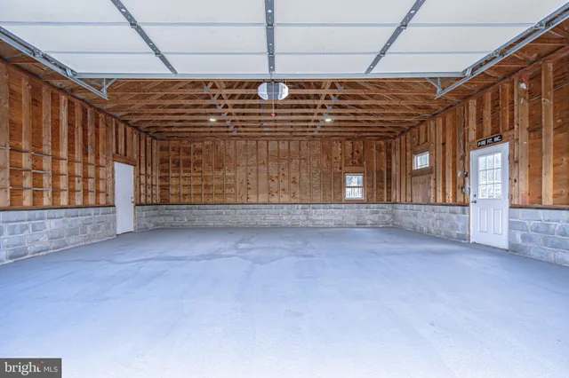 a view of an empty room with wooden walls