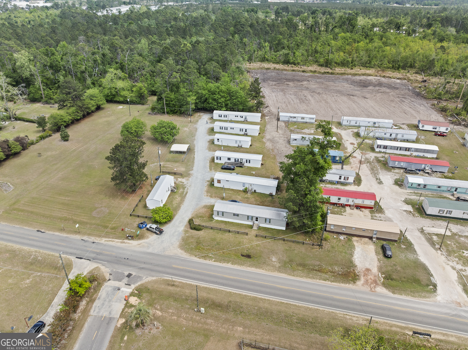 227 Bell Telephone Road Hazlehurst, GA 31539 - Photo 16 of 17 an aerial view of a house with a garden and plants