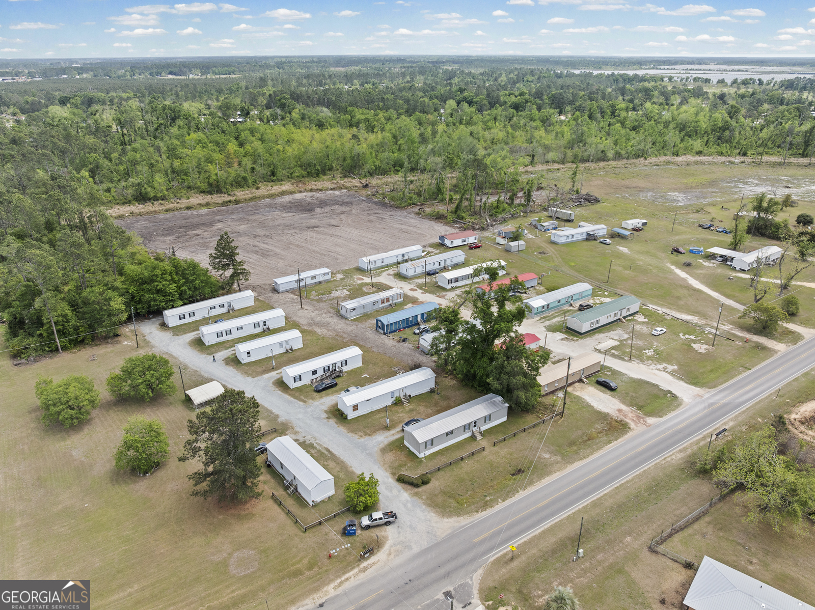 227 Bell Telephone Road Hazlehurst, GA 31539 - Photo 20 of 20 a view of a lake with a mountain