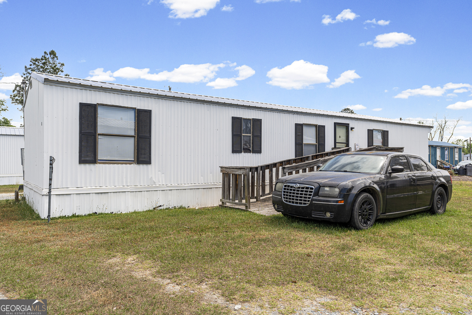 227 Bell Telephone Road Hazlehurst, GA 31539 - Photo 6 of 17 a front view of a house with a garden