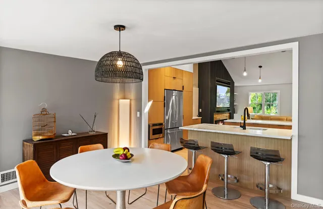 a dining room with furniture and window