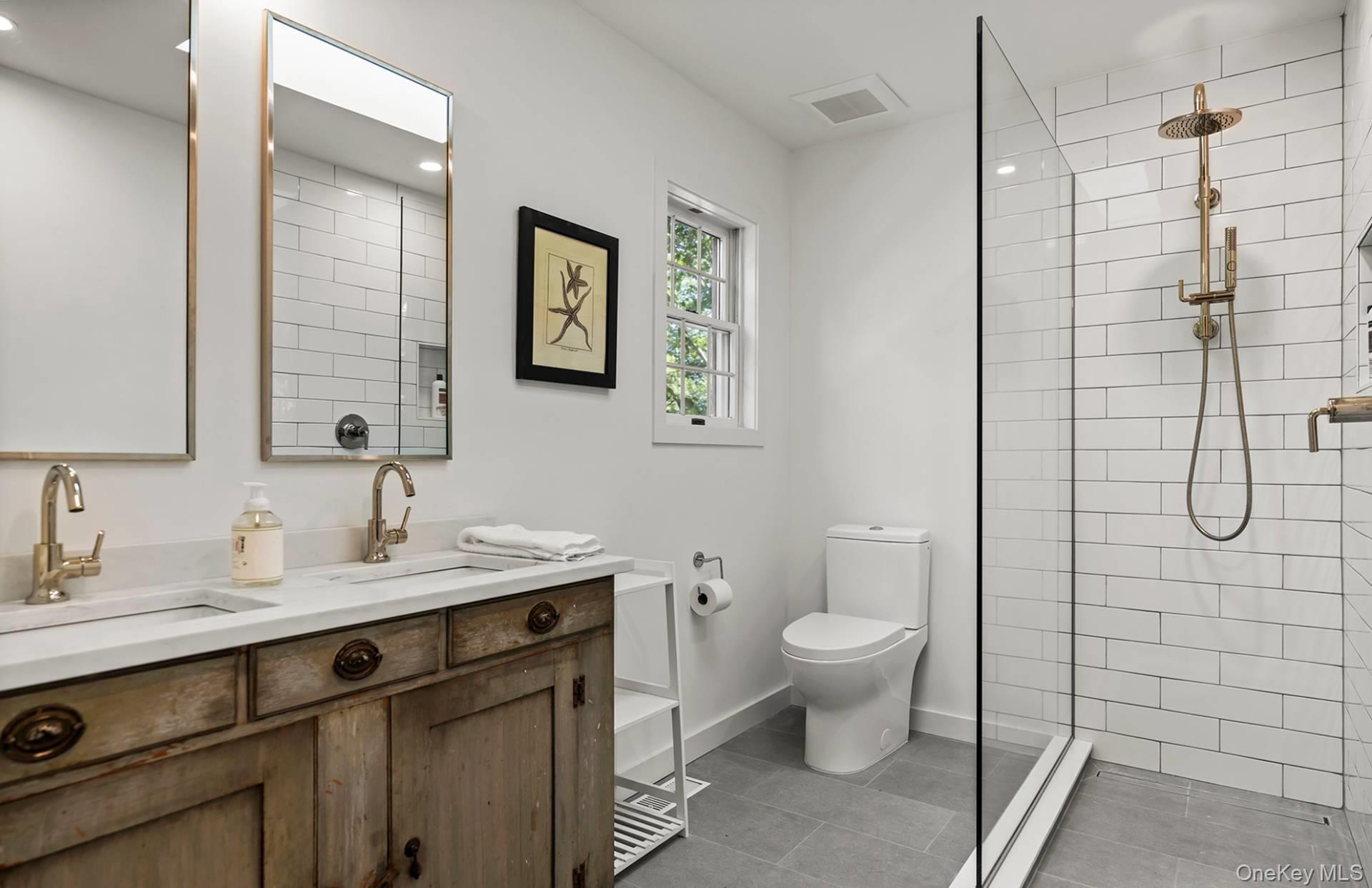 7 Sims Avenue Sag Harbor, NY 11963 - Photo 20 of 30 a bathroom with a sink toilet and shower