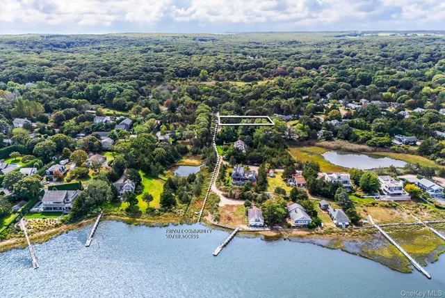 an aerial view of a houses with a swimming pool