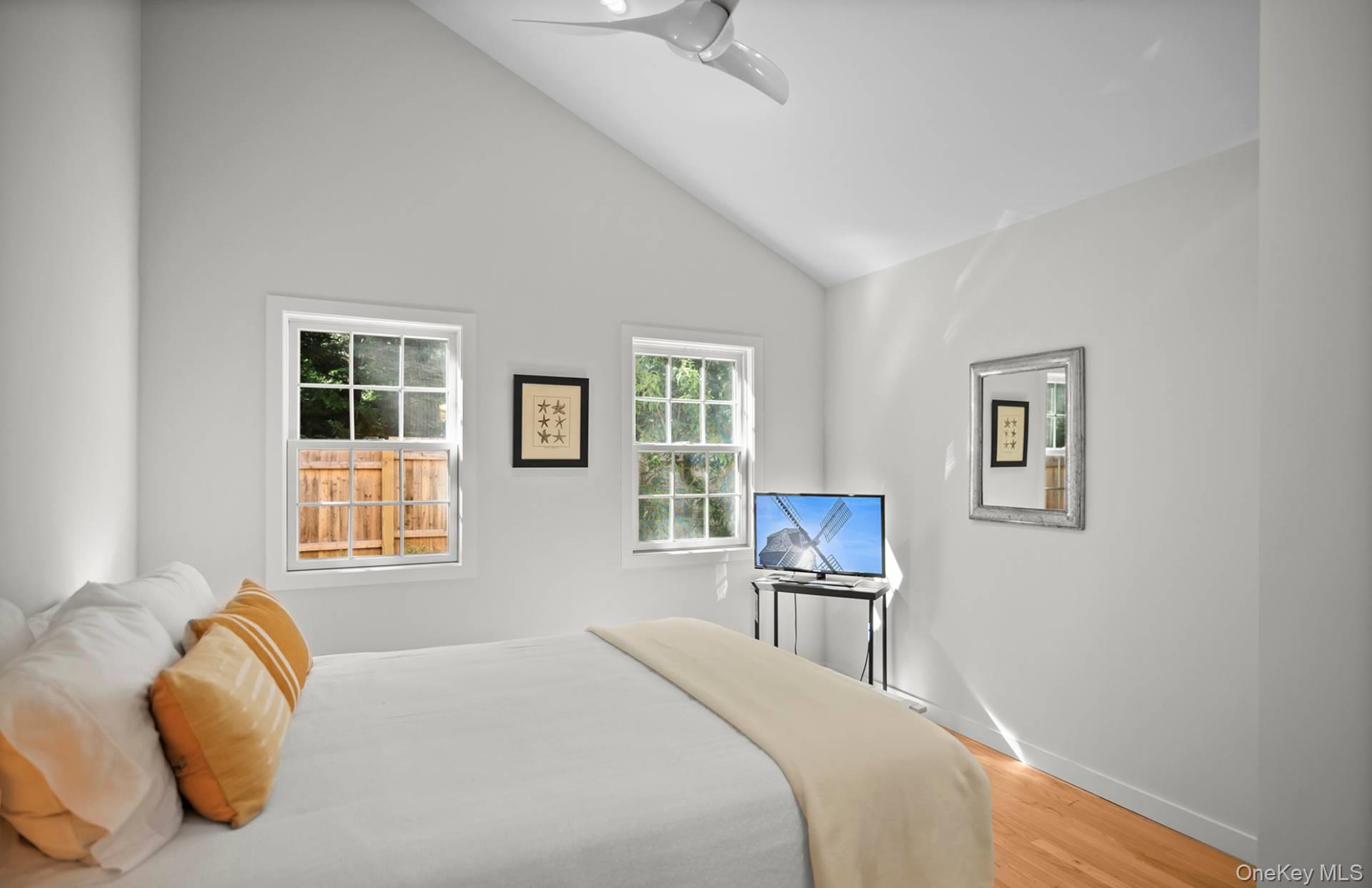 7 Sims Avenue Sag Harbor, NY 11963 - Photo 23 of 30 a bedroom with a bed and a window
