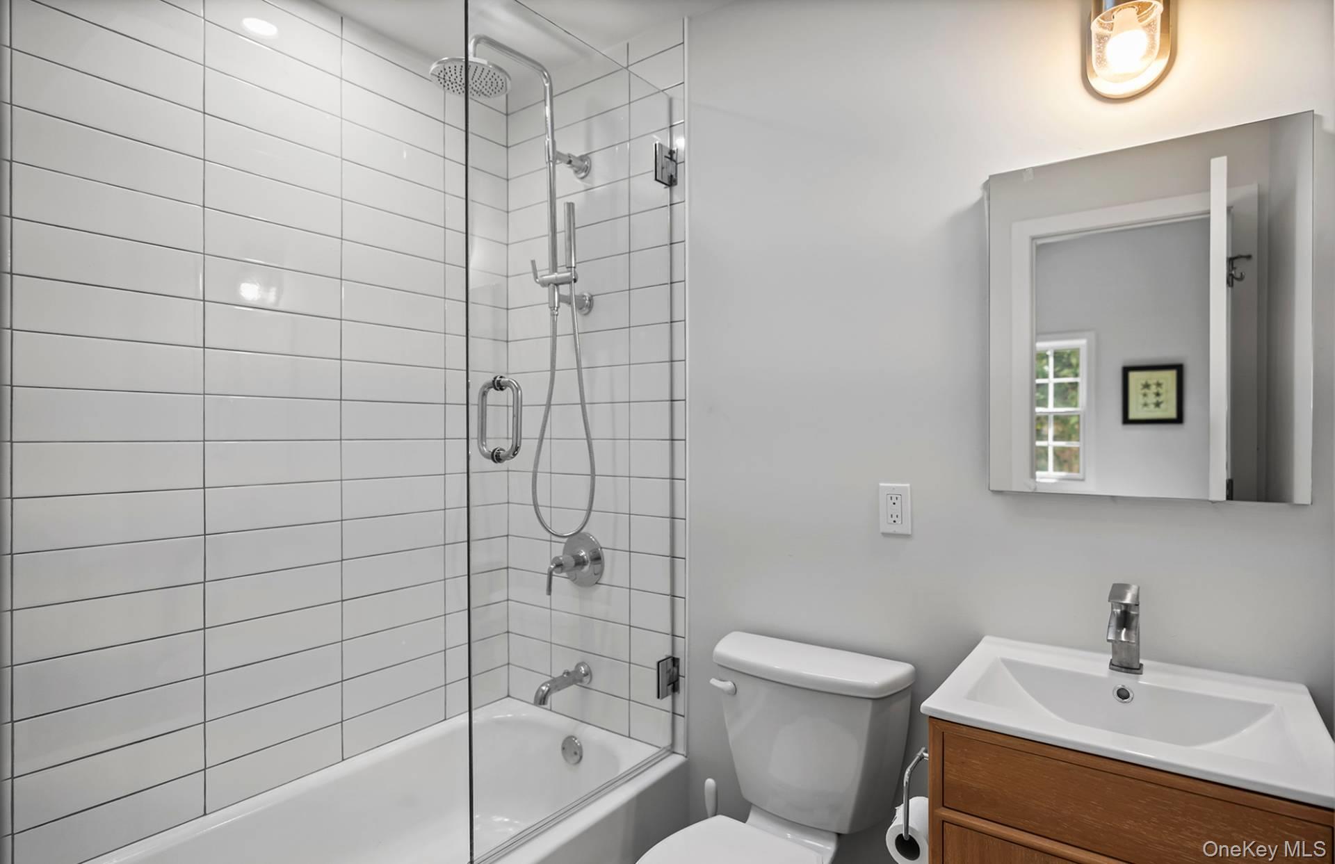 7 Sims Avenue Sag Harbor, NY 11963 - Photo 24 of 30 a bathroom with a sink toilet and shower