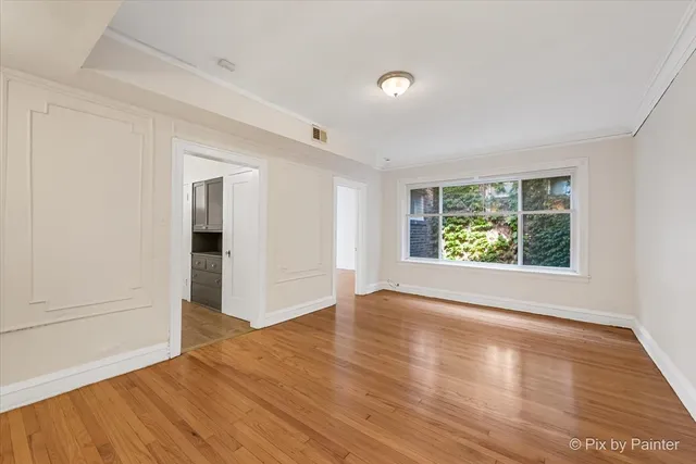 an aerial view of residential building with green space