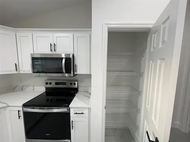 a kitchen with a sink and a window