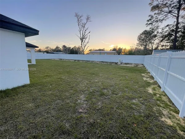 a view of an ocean and a yard