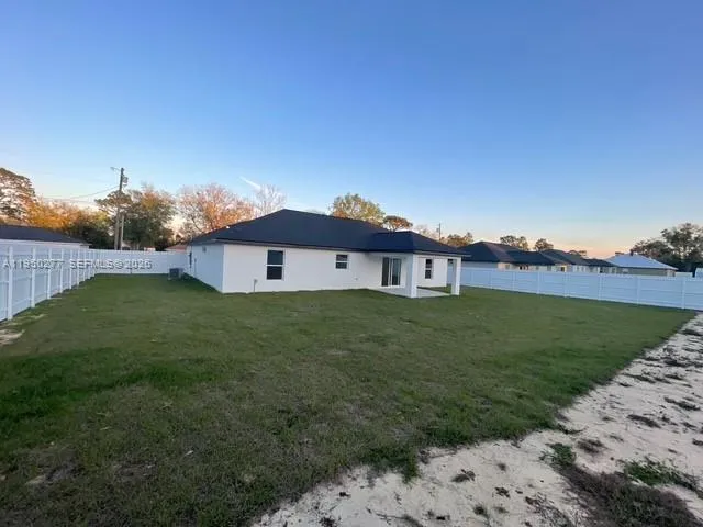 a view of a house with a big yard