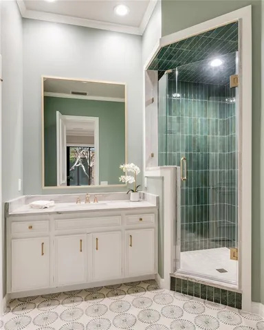 a bathroom with a shower sink and mirror