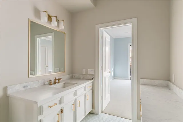 a bathroom with a sink a mirror and a shower