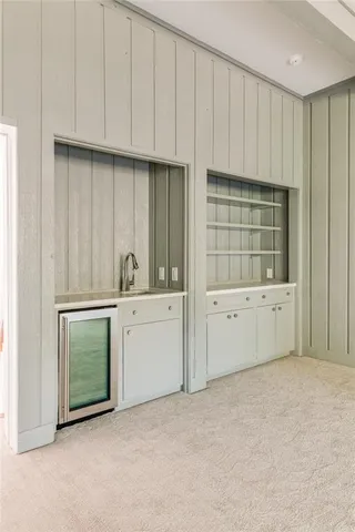 a view of a kitchen with sink and cabinet
