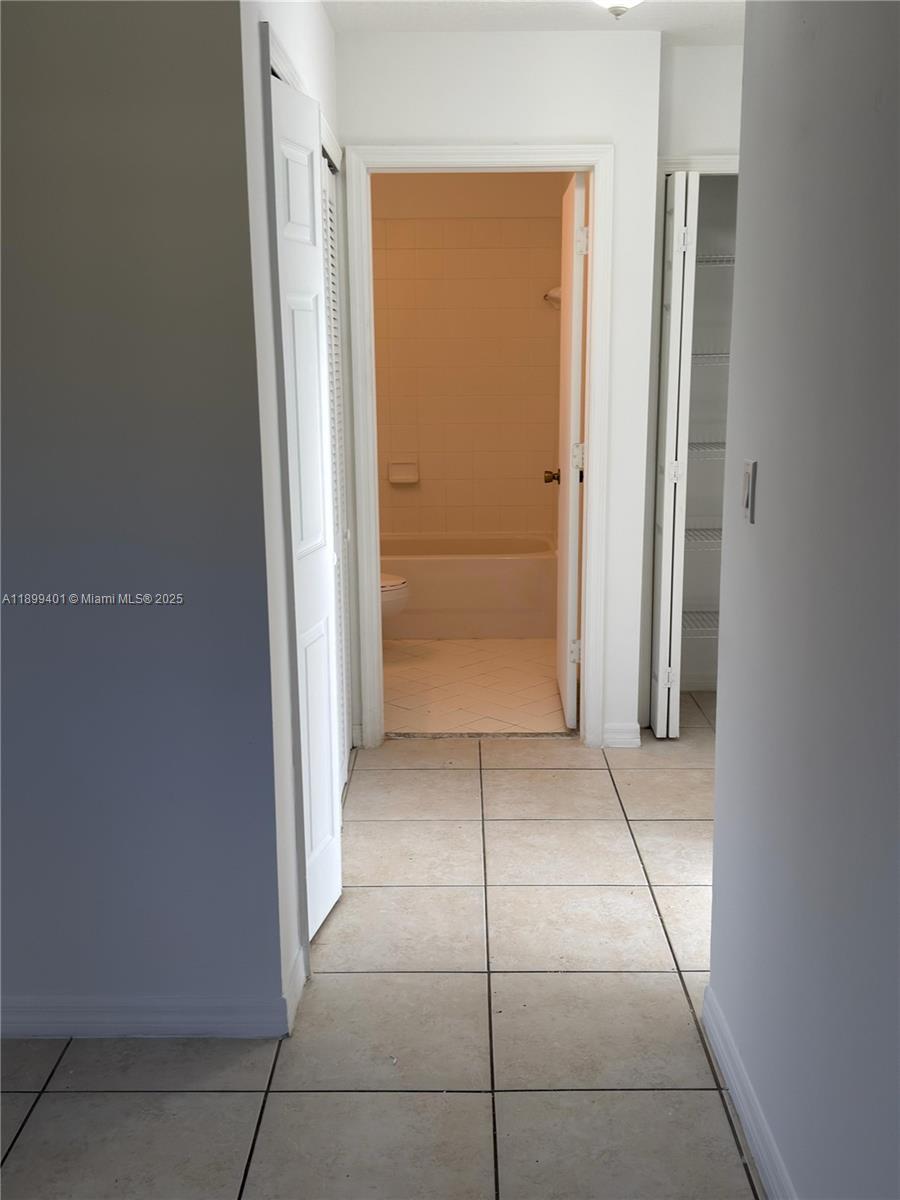 930 Northeast 34th Avenue, Unit 201 Homestead, FL 33033 - Photo 18 of 26 an empty room with closet