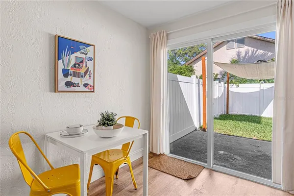 a view of an outdoor dining space with furniture