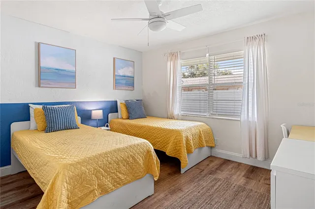 a bedroom with double bed and a window