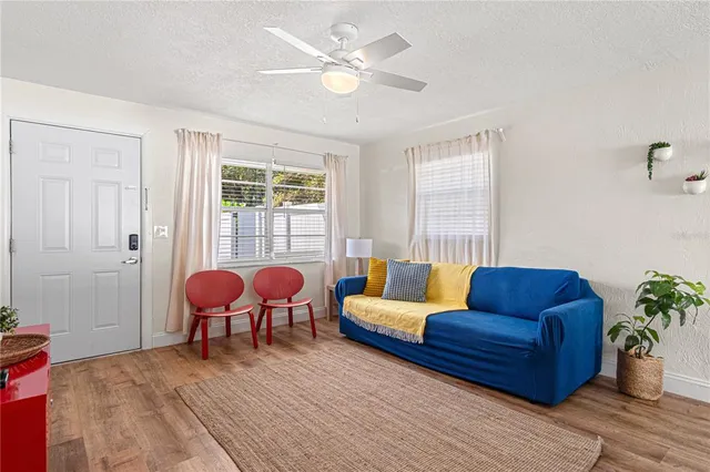 a living room with furniture and a large window