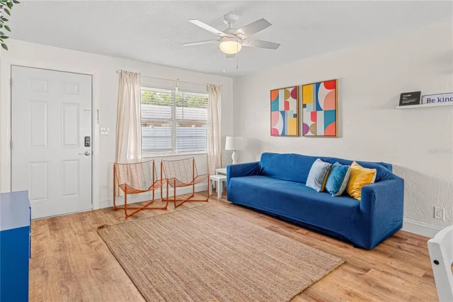 a living room with furniture and a window