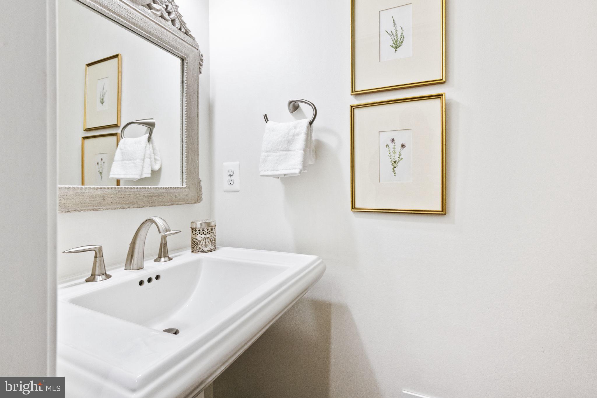 1411 Ridgeview Way Washington, DC 20007 - Photo 23 of 56 a bathroom with a sink and mirror