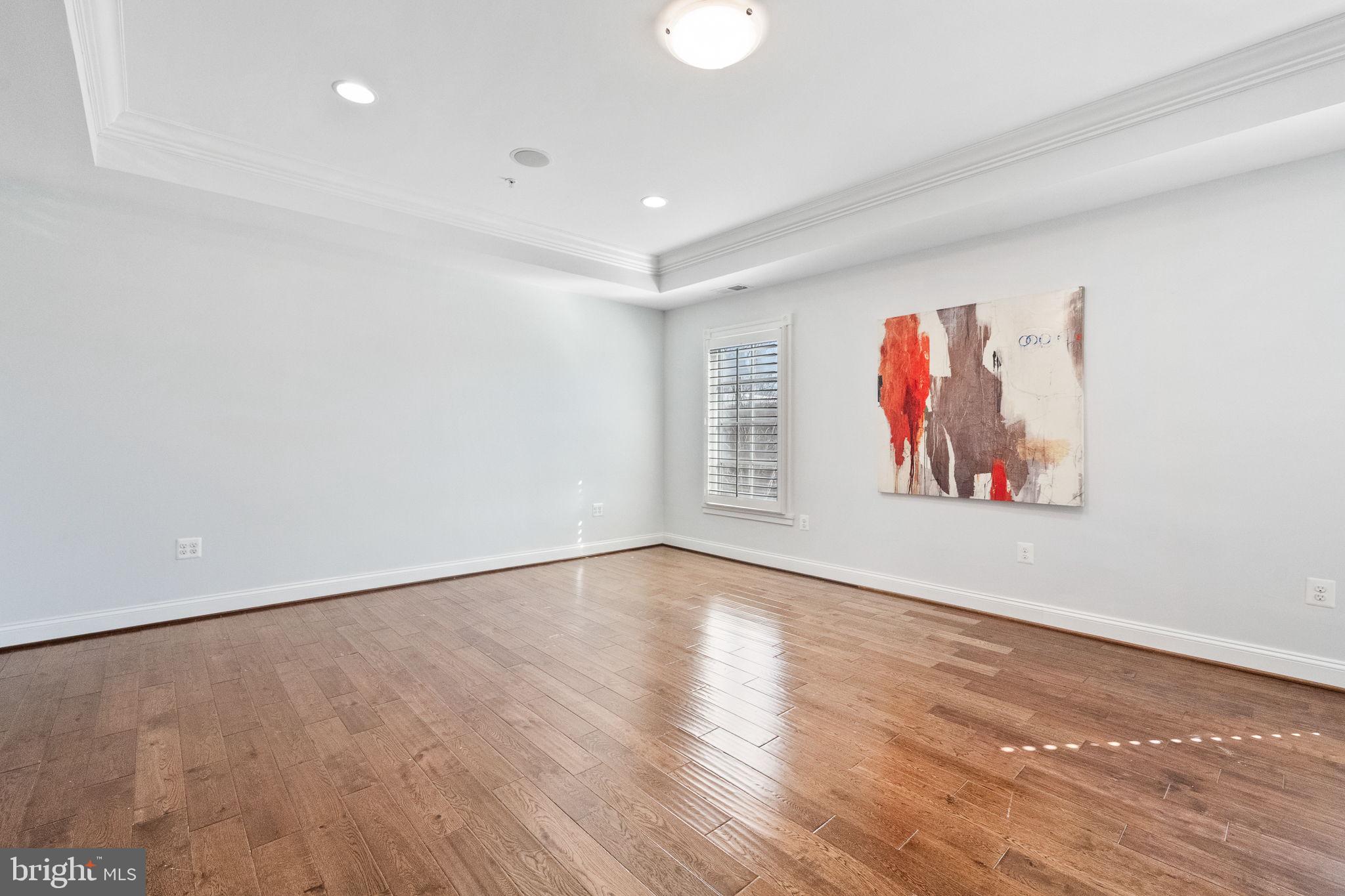 1411 Ridgeview Way Washington, DC 20007 - Photo 27 of 56 a view of an empty room with wooden floor and window