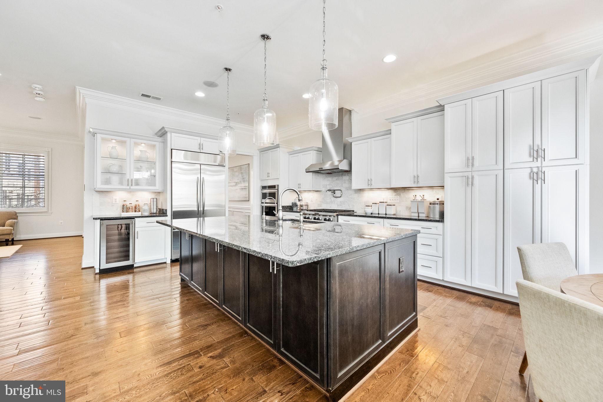 1411 Ridgeview Way Washington, DC 20007 - Photo 3 of 56 a kitchen with stainless steel appliances granite countertop a sink a stove and a refrigerator