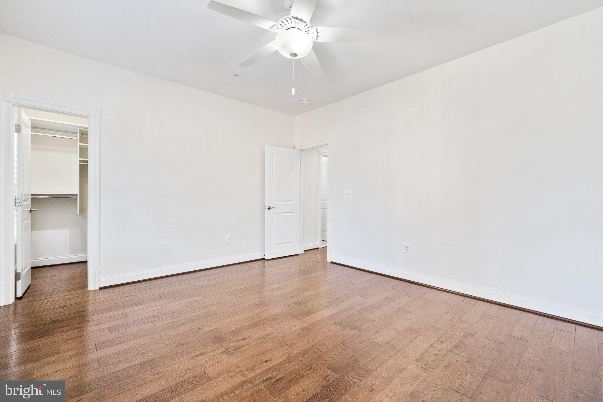 1411 Ridgeview Way Washington, DC 20007 - Photo 34 of 56 a view of an empty room with wooden floor