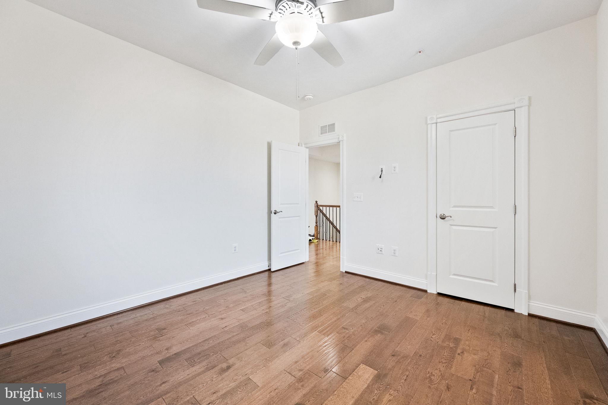 1411 Ridgeview Way Washington, DC 20007 - Photo 39 of 56 a view of an empty room with wooden floor
